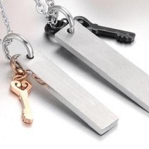 2 Piece Stainless Steel Couple Necklace With Charm..